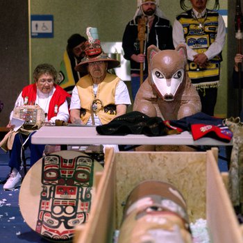 Members of the Tlingit Nation welcome a recently returned Bear Clan Totem during a ceremony in Angoon, Alaska, November 1, 2003 3