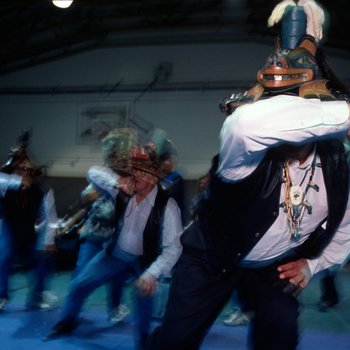 Daniel Brown dances in celebration of a recently returned Bear Clan Totem during a welcoming ceremony in Angoon, Alaska, November 1, 2003