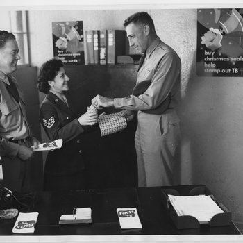 Col. John Reynolds at Ellington Air Force Base Purchasing Seals from Staff Sergeant Mary Onanian, 1949