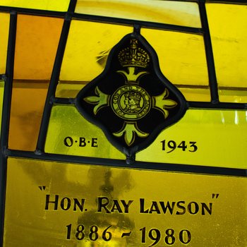 Detail, Insignia for O.B.E and Inscription for Hon. Ray Lawson from The Lord is My Shepherd Window or Lawson Memorial Window