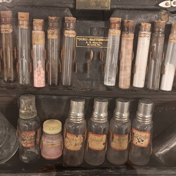 Leather box with empty medicine vials