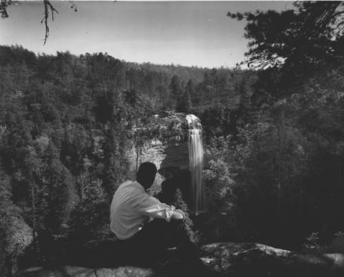 A view of the Fall Creek Falls, with J. W. Wheeler of Unionville, Tennessee, in the foreground (f5ffa4d03004713e52ecc3a0d56b6094)