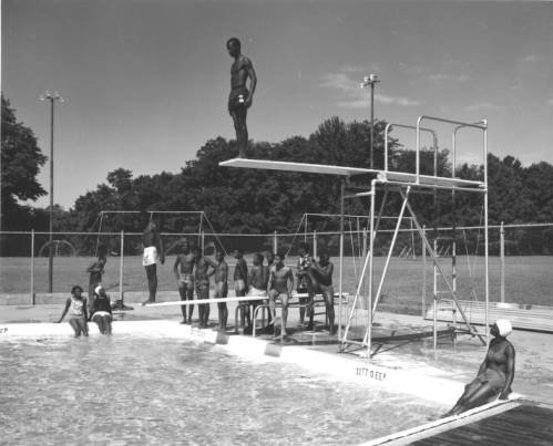 Young men diving at the swimming pool in T.O. Fuller State Park (762b3ff57f2a979b252d88e5170a791a)