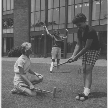 A group of women playing a game of croquet at Paris Landing State Park