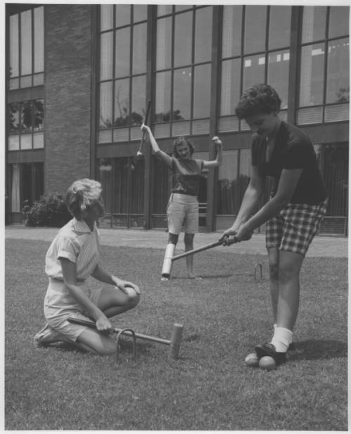 A group of women playing a game of croquet at Paris Landing State Park (84dd4b45bb3779b7e0f61294a6f7f87b)