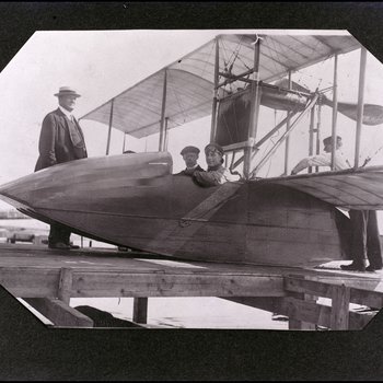 Tony Jannus Poses with Passenger on the Benoist Airboat No. 43 While Others Tend to the Plane, Tampa