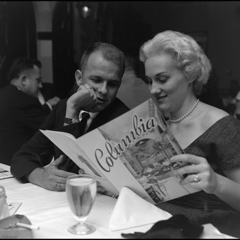 Couple Examines Menu at the Columbia Restaurant