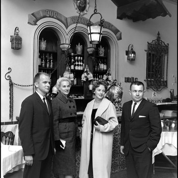 Two Couples Stand in Front of the Bar at the Columbia Restaurant