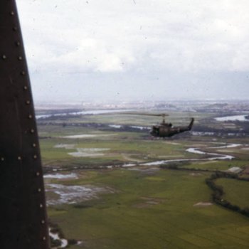 A UH-1 "Huey" helicopter in flight in Vietnam