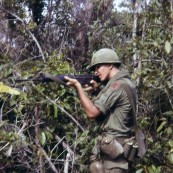 Christopher Ammons firing an M16, Vietnam, 1967-1968