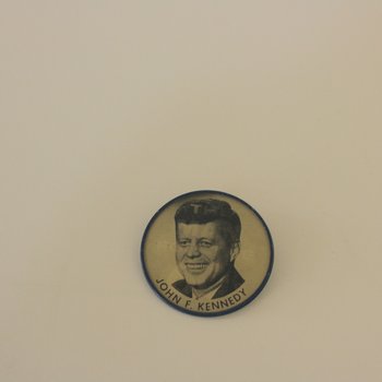 Man for the 60s holographic campaign button, 001