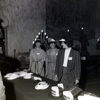 Marsha Massey, Whitney T. and an Unknown Employee at Merchandise Table, First Florida Bank, Tampa