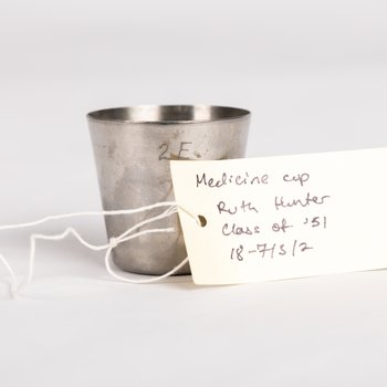 Medicine Cup and Medicine Bottle of Ruth Hunter '51