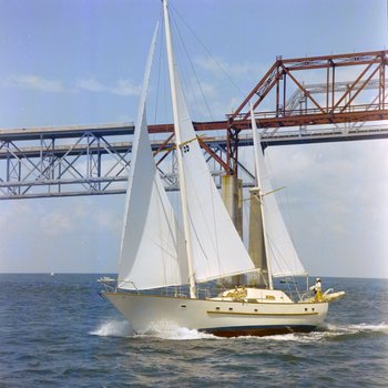 Women on Sailboat Under Sunshine Skyway Bridge, Featherstone Marine