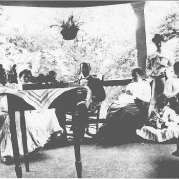 Madge Hall, Mary Mitchell, John Mitchell, Mrs. Charles Mitchell, Margaret Mitchell (McCloud), George Mitchell, and Marie Lipscomb on the Mitchell's porch.