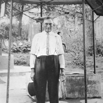 Man standing next to a mineral spring