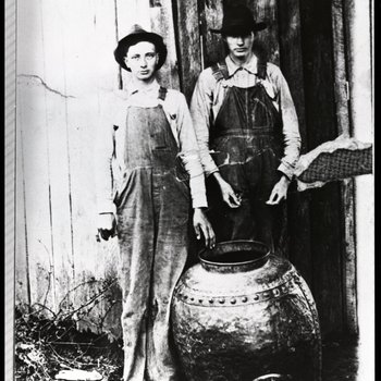 Charlie and Willie Hall with their moonshine still Clay County, Tennessee, ca. late 1920s