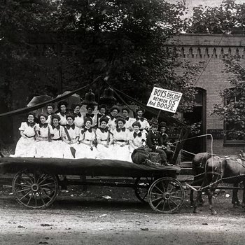 Women from Martin College carrying a sign"BOYS, decide between US and BOOZE." Pulaski, Tennessee, ca. 1910s