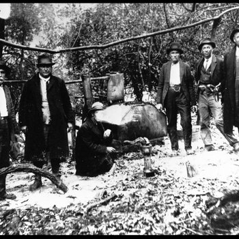 Bob Holland, Sheriff J. L. "Fate" Smith, and deputies after a raid on a still, Humphreys County, Tennessee, ca. 1920s