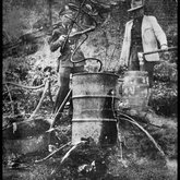 Two men destroying a still Rockdale, Tennessee, ca. 1930s