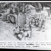 Four men at a moonshine still on the rear of Fredonia Mountain, Little Brush Creek, Sequatchie County, Tennessee, ca. 1900