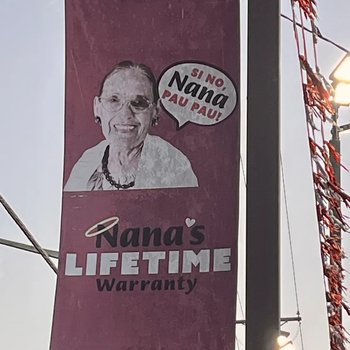 Photograph of Charlie Clark "Nana's Lifetime Warranty" Sign