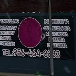 Photograph of "Now Enrolling/Inscríbete Ya" Cosmetology Ad