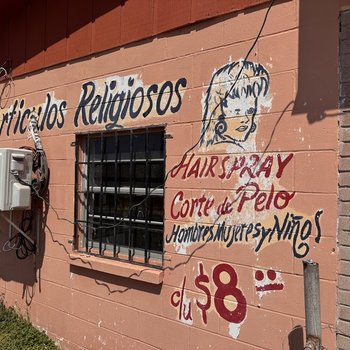 Photograph of Barbershop/Corte de Pelo Ad