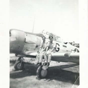 Watters Jim Course 25 Image 3 sitting on wing of AT-6