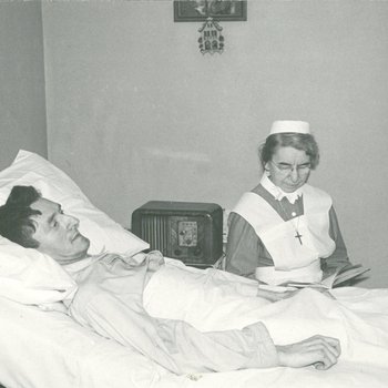 Nurse reading to patient