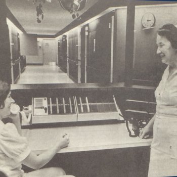 Two nurses at reception desk