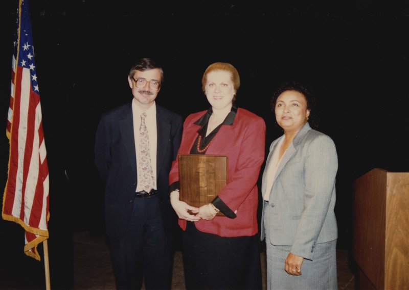 Dr. Rasche receiving the Outstanding Teacher Award in 1987.