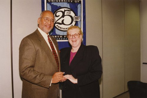 Dr. Rasche and University of North Florida President Adam Herbert at 25th Anniversary Committee Pin Presentation ceremony on January 18, 1997