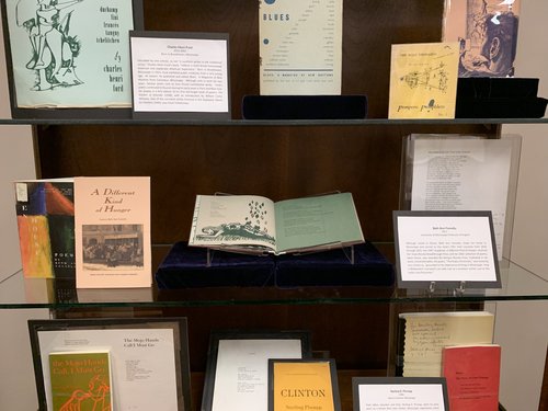 display of publications by Beth Ann Fennelly: Open House, A Different Kind of Hunger, Unmentionables, draft poem. exhibit card about Fennelly in photo has been transcribed on the page.