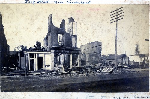 This photograph features an image of the destruction caused by the earthquake to a structure on King Street, near Vanderhorst Street, in Charleston, South Carolina.