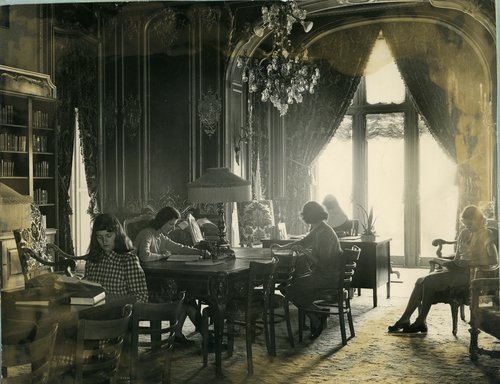 The Salve Regina College library was in McAuley Hall from 1957 to 1991. This photo shows students from the 1950s studying in the reference room.