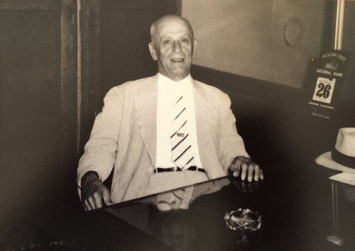 S.N. Thomas at his desk at S.N. Thomas’ Sons