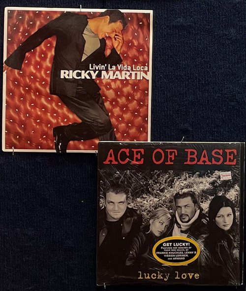 Vinyl records (1) Living La Vida Loca / Ricky Martin (1999) Lucky Love / Ace of Base (1996)