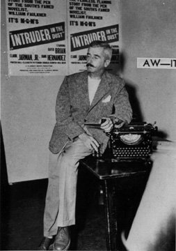 William Faulkner poses with his typewriter at the Lyric Theater