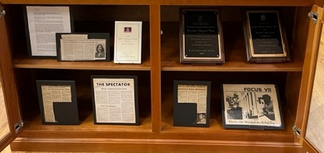 display case containing award plaques, and photographs from Dorothye Quaye Chapman Reed Collection