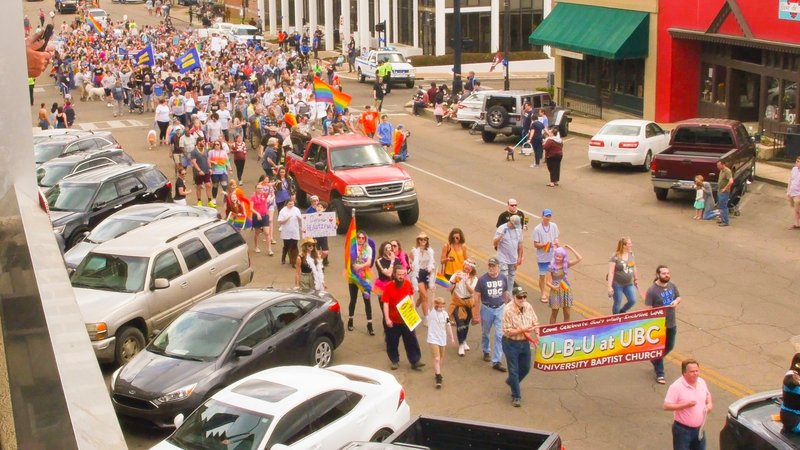 The Starkville Pride parade as seen from a balcony