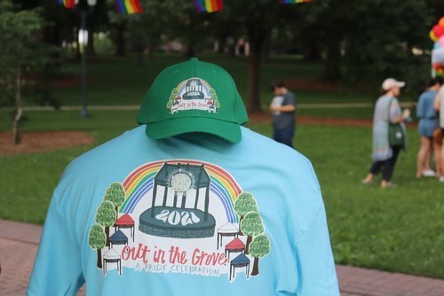 For sale: t-shirts and hats for the day&#x27;s event, Out in the Grove: A Pride Celebration