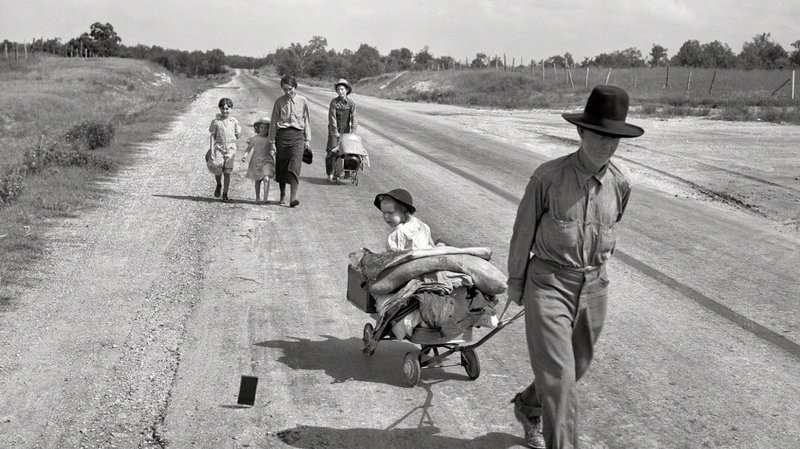 A family walks down a road.