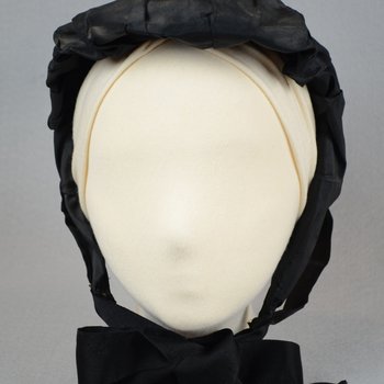 Bonnet, black silk, possibly for mourning, c. 1860s, front view