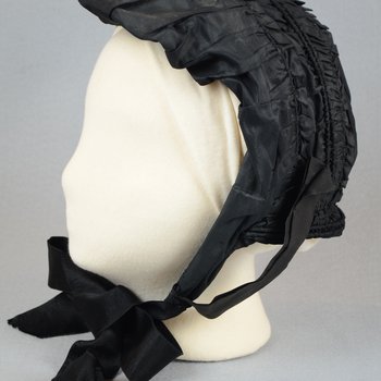Bonnet, black silk, possibly for mourning, c. 1860s, side view